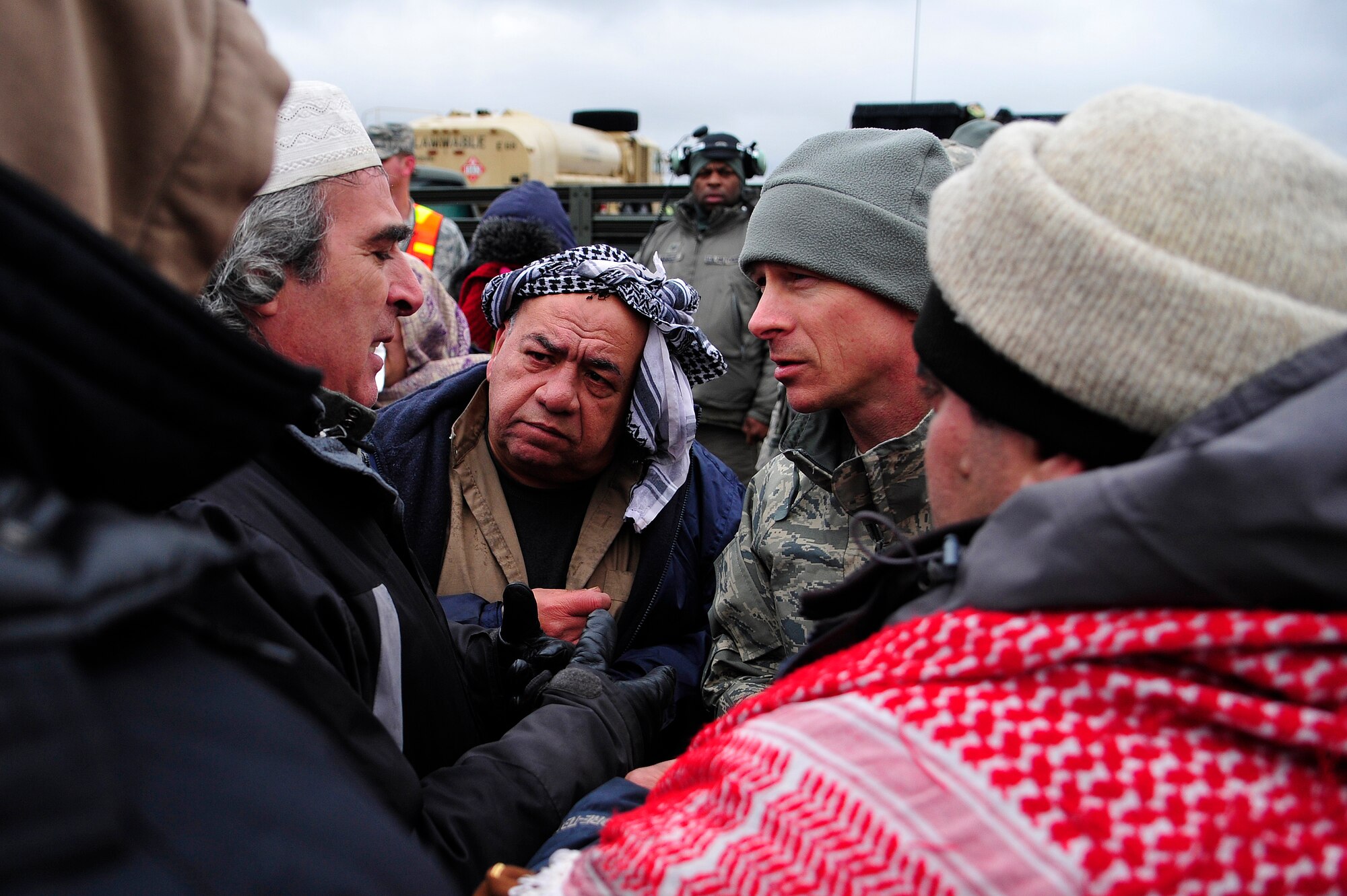 Col. David Kuenzli speaks with simulated local villagers during U.S. Transportation Command’s joint task force validation exercise Eagle Flag 13-2 March 19, 2013, at Joint Base McGuire-Dix-Lakehurst, N.J. Kuenzli and 150 Airmen from the 817th Contingency Response Group were simulating the establishment of an aerial port of debarkation in a fictional country in preparation for worldwide alert duties. Kuenzli is the 817th CRG commander. (U.S. Air Force photo/Tech. Sgt. Parker Gyokeres)