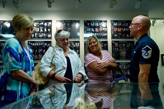 Master Sgt. Ryan Ulrich, U.S. Air Force Demonstration Squadron Public Affairs superintendent, gives a tour of the Thunderbirds Museum to (from left to right) Mary Byers, American Gold Star Mothers national president; Nancy Soltes, American Gold Star Mothers member; and Sue Pollard, Southern California and Hawaii American Gold Star Mothers president, March 20, 2013, at Nellis Air Force Base, Nev. The American Gold Star Mothers is an organization of mothers who have lost a son or daughter in the service of the United States. (U.S. Air Force photo by Airman 1st Class Christopher Tam)  