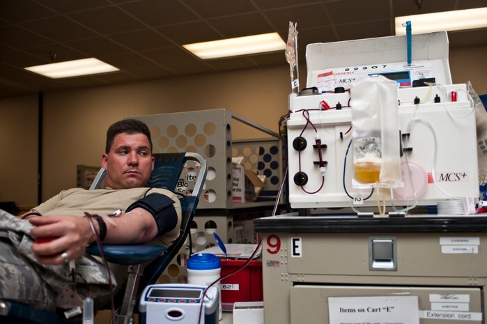 Tech. Sgt. Tim Bennett, 757th Aircraft Maintenance Squadron assistant section chief, donates blood at the 57th Wing blood drive March 25, 2013, at Nellis Air Force Base, Nev. One unit of blood can be separated into several components such as red blood cells, plasma, platelets, and cryoprecipitate. Donor blood is used to help women who have complications during childbirth, patients with cancer, children with Sickle Cell Disease, accident victims, patient undergoing certain kinds of surgeries, and it also supports patients at the Mike O'Callaghan Federal Medical Center. (U.S. Air Force photo by Airman 1st Class Jason Couillard)