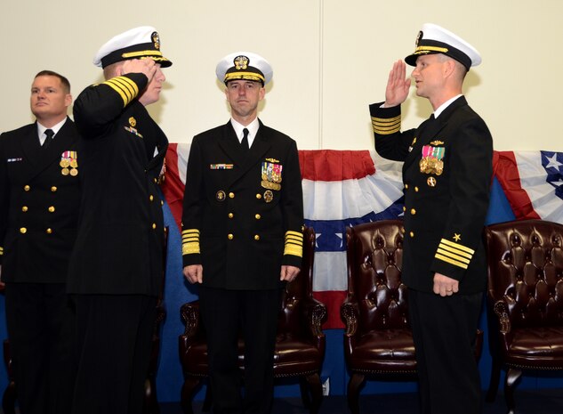 Admiral John Richardson, Director, Naval Nuclear Propulsion (center), presides over the Navy Nuclear Power Training Unit change of command ceremony as Navy Capt.  Robert Hudson (left) relieves Navy Capt. Dennis White March 22, 2013, at the Bowman Center at Joint Base Charleston – Weapons Station.  (US Navy photo/ Petty Officer 1st Class Chad Hallford)