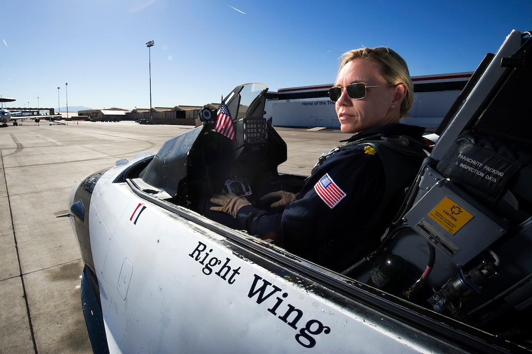 Air Force Maj. Caroline Jensen prepares for a practice show launch on Nellis Air Force Base, Nev., March 13, 2013. Jensen, a pilot for the Thunderbird 3, Right Wing, is one of 13 females assigned to the Air Force Thunderbirds air demonstration squadron for the 2013 show season, and the fourth female pilot and first female reservist demonstration pilot in team history.