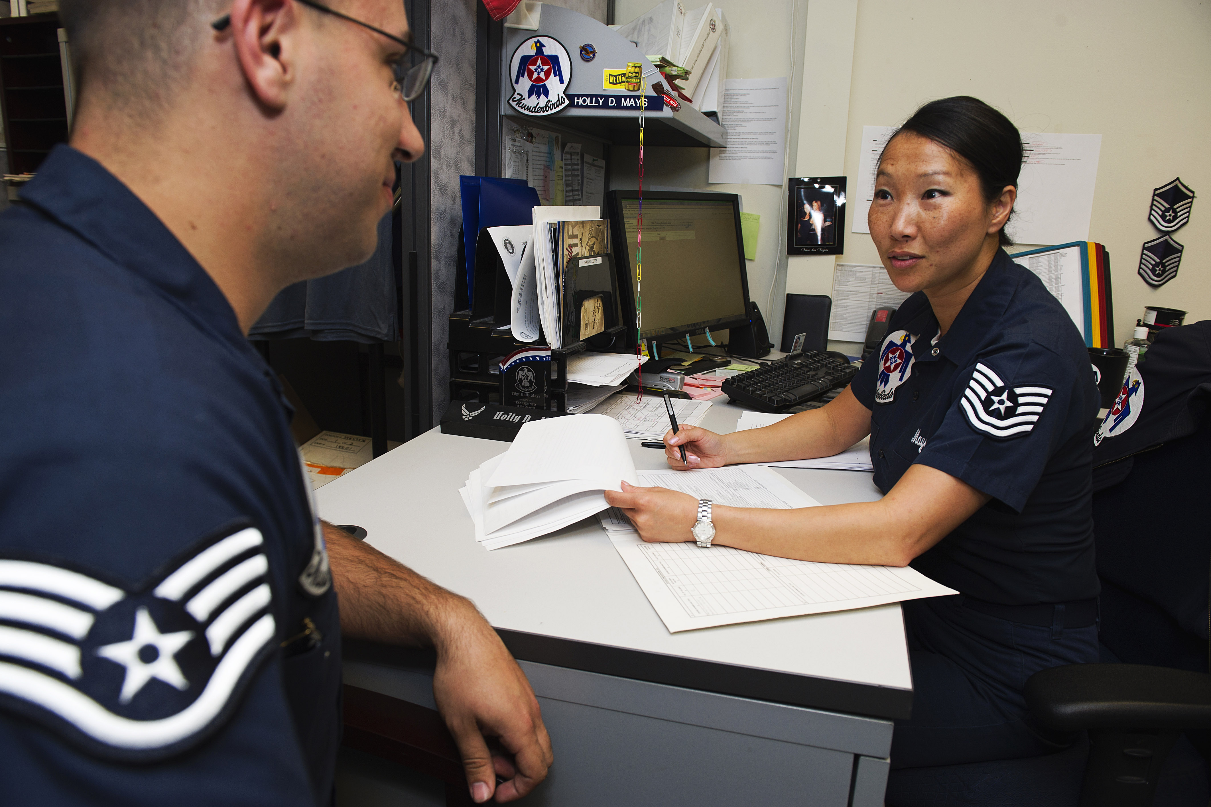 Air Force Tech Sgt Holly Mays Reviews Training Documents With Air Force Staff Sgt Tarkha Barbedo