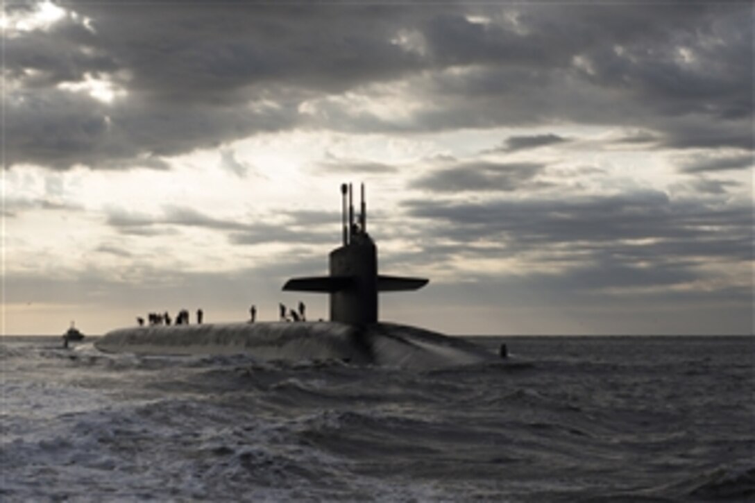 Crewmen go to their stations on deck as the ballistic missile submarine USS Rhode Island (SSBN 740) returns to Naval Submarine Base Kings Bay, Ga., on March 20, 2013.  