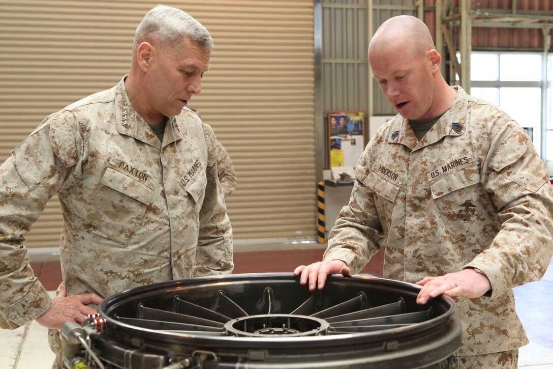 The Assistant Commandant of the Marine Corps, Gen. John M. Paxton, Jr., visits with Marines while on a base tour of Marine Corps Air Station Iwakuni, Japan, March 11, 2013. The tour was hosted by Col. James Stewart. (U.S. Marine Corps photo by Cpl. Tia Dufour/Released)
