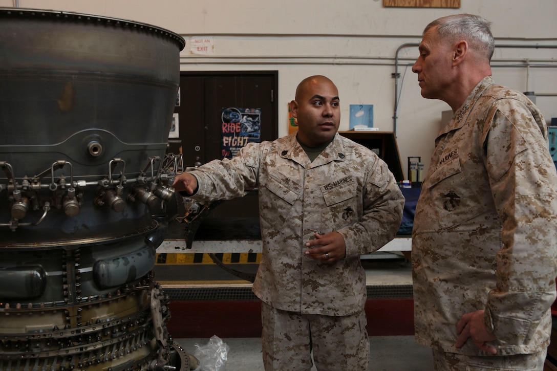 The Assistant Commandant of the Marine Corps, Gen. John M. Paxton, Jr., visits with Marines while on a base tour of Marine Corps Air Station Iwakuni, Japan, March 11, 2013. The tour was hosted by Col. James Stewart. (U.S. Marine Corps photo by Cpl. Tia Dufour/Released)