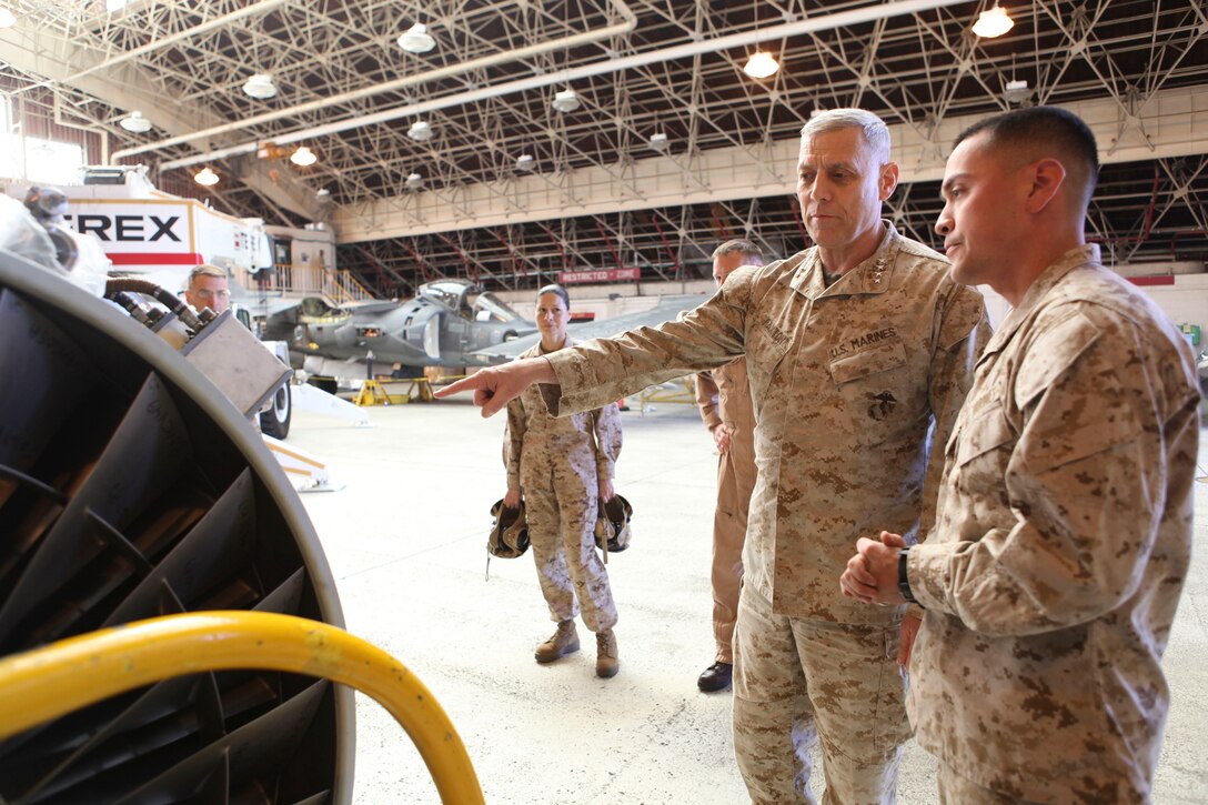 The Assistant Commandant of the Marine Corps, Gen. John M. Paxton, Jr., visits with Marines while on a base tour of Marine Corps Air Station Iwakuni, Japan, March 11, 2013. The tour was hosted by Col. James Stewart. (U.S. Marine Corps photo by Cpl. Tia Dufour/Released)