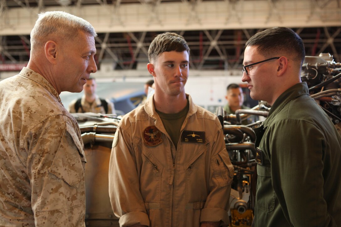 The Assistant Commandant of the Marine Corps, Gen. John M. Paxton, Jr., visits with Marines while on a base tour of Marine Corps Air Station Iwakuni, Japan, March 11, 2013. The tour was hosted by Col. James Stewart. (U.S. Marine Corps photo by Cpl. Tia Dufour/Released)