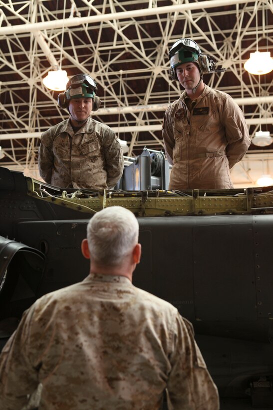 The Assistant Commandant of the Marine Corps, Gen. John M. Paxton, Jr., visits with Marines while on a base tour of Marine Corps Air Station Iwakuni, Japan, March 11, 2013. The tour was hosted by Col. James Stewart. (U.S. Marine Corps photo by Cpl. Tia Dufour/Released)