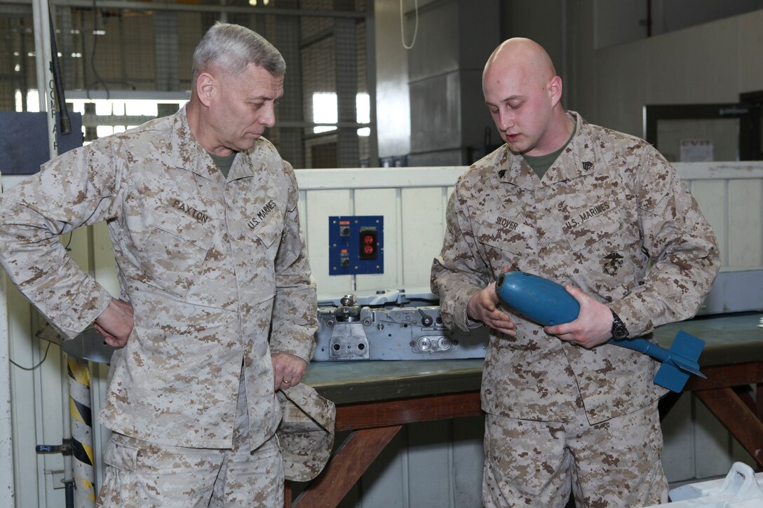 The Assistant Commandant of the Marine Corps, Gen. John M. Paxton, Jr., visits with Marines while on a base tour of Marine Corps Air Station Iwakuni, Japan, March 11, 2013. The tour was hosted by Col. James Stewart. (U.S. Marine Corps photo by Cpl. Tia Dufour/Released)