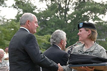 Jenna Simmons of Milledgeville, Ga., shakes hands with Gov. Sonny Perdue.