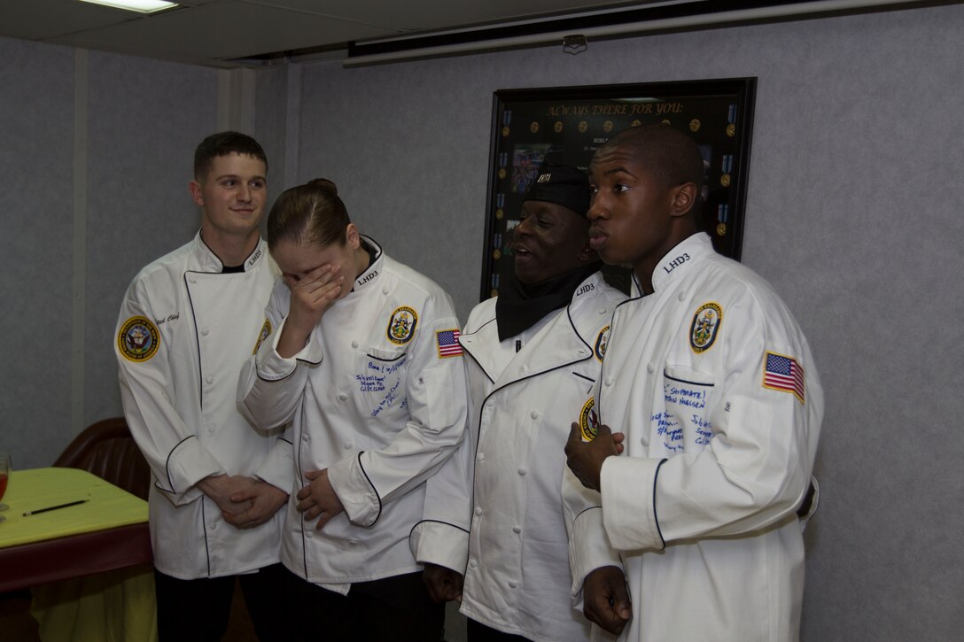 Marines assigned to the 26th Marine Expeditionary Unit (MEU) celebrate winning the Steel Chef competition aboard the USS Kearsarge (LHD 3) while at sea March 23, 2013. In the Steel Chef competition, three Marines cook against three Sailors to see who can create the best meal in less than 90 minutes. The 26th MEU is deployed to the 6th Fleet area of operation. The MEU operates continuously across the globe, providing the president and unified combatant commanders with a forward-deployed, sea-based, quick-reaction force. The MEU is a Marine Air-Ground Task Force capable of conducting amphibious operations, crisis-response and limited contingency operations. (U.S. Marine Corps photo by Cpl. Kyle N. Runnels/Released)