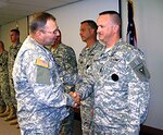 Brig. Gen. Matthew L. Kambic, Ohio's assistant adjutant general for Army, congratulates 1st Sgt. Jeff Collingsworth on his promotion to first sergeant in the Ohio Army National Guard Recruiting and Retention Battalion. Collingsworth is the Area Noncommissioned Officer in Charge of the Central Recruiting Area.