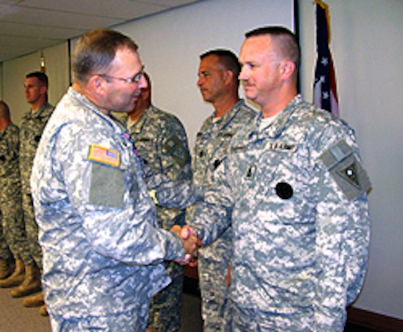 Brig. Gen. Matthew L. Kambic, Ohio's assistant adjutant general for Army, congratulates 1st Sgt. Jeff Collingsworth on his promotion to first sergeant in the Ohio Army National Guard Recruiting and Retention Battalion. Collingsworth is the Area Noncommissioned Officer in Charge of the Central Recruiting Area.