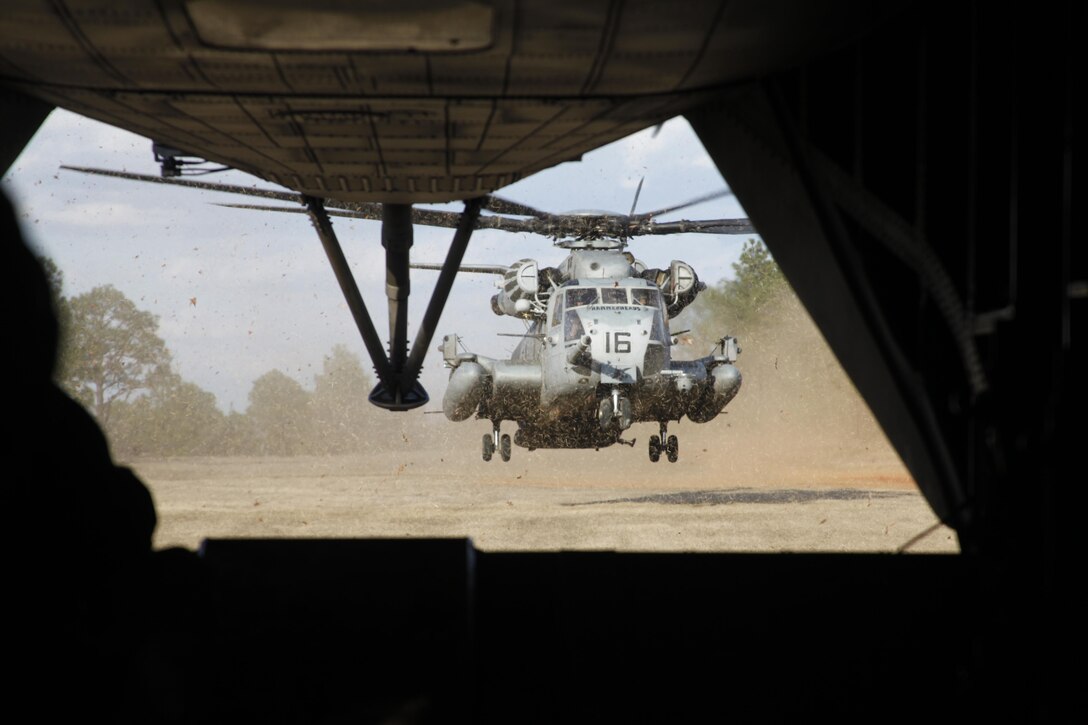 A CH-53E Super Stallion with HMH-366 sets down in a landing zone to pick up Army howitzers and artillery crews at Fort Bragg. The CH-53E is the largest and heaviest helicopter in the U.S. military. The heavy-lift cargo helicopter can transport up to 55 troops or 30,000 pounds of cargo and can carry externally slung loads up to 36,000 pounds. With a cruise speed of more than 150 mph and a range of approximately 600 miles, it provides assault transportation of combat troops, supplies and equipment during expeditionary, joint or combined operations. The squadron must be prepared for short-notice, worldwide employment in support of Marine Air-Ground Task Force operations.