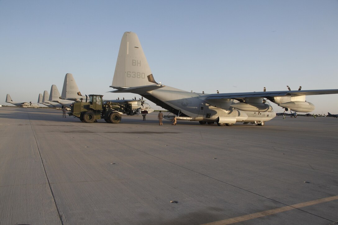A forklift loads gear and supplies onto a Marine Aerial Refueler Transport Squadron 252 KC-130J Hercules at Marine Corps Air Station Yuma, Ariz., March 22. VMGR-252 transported 20,000 pounds of gear to the course. 