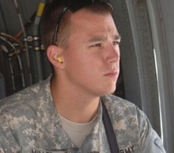 Spc. Brett Miller, Bismarck, N.D., videos medical evacuation operations on a flight line in Bagram Airfield, Afghanistan. Miller and two other 129th Mobile Public Affairs Detachment Soldiers traveled to eastern Afghanistan to report on the progress of coalition forces.