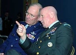 LTG H Steven Blum, right, chief of the National Guard Bureau, confers with Lt. Gen. Craig McKinley, director of the Air National Guard, during the National Guard Association of the United States' General Conference in Albuquerque, N.M. Blum told the group that the Guard's domestic resources need to be significantly improved.