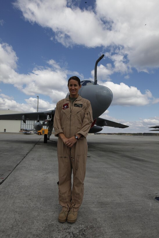 Capt. Catherine Schmidt, a naval flight officer with Marine Tactical Electronic Warfare Squadron 2, stands in front of an EA-6B Prowler March 26.