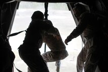 Marines with Special Operations Training Group gather a rope descending from an MV-22B Osprey flown by Marines with Medium Tiltrotor Training Squadron 263 during rappelling and fast-roping training, March 21. The Marines rappelled and fast-roped out of the Osprey 50 feet above ground during the training. 

