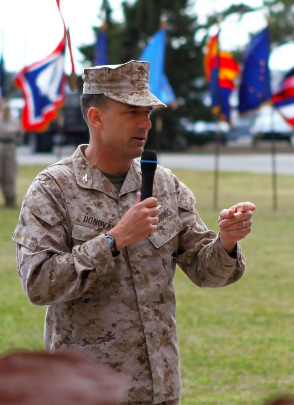 Col. Frank Donovan, the outgoing commanding officer for the 24th Marine Expeditionary Unit, speaks to family and friends during a change of command ceremony aboard Camp Lejeune, N.C., March 21, 2013. Col. Scott F. Benedict has assumed command of the 24th MEU and is responsible for leading the unit through its next training cycle and deployment scheduled for 2014. (Official USMC Photo by Cpl. Michael Petersheim/Released)