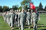 Capt. Jacob Roy leads the Vermont Army National Guard's 131st Engineer Company onto the Fort McCoy, Wis., parade field during a deployment ceremony Sept. 23, 2006. The 131st includes Soldiers from Vermont and Indiana, and is attached to the Arkansas Army National Guard's 875th Engineer Battalion, which departed Arkansas July 22. The unit has finished a grueling two-month training regiment at Fort McCoy and will depart shortly on a year-long deployment in support of Operation Iraqi Freedom.