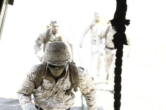 Marines with Special Operations Training Group gather a rope descending from an MV-22B Osprey flown by Marines with Medium Tiltrotor Training Squadron 263 during rappelling and fast-roping training, March 21. The Marines rappelled and fast-roped out of the Osprey 50 feet above ground during the training. 
