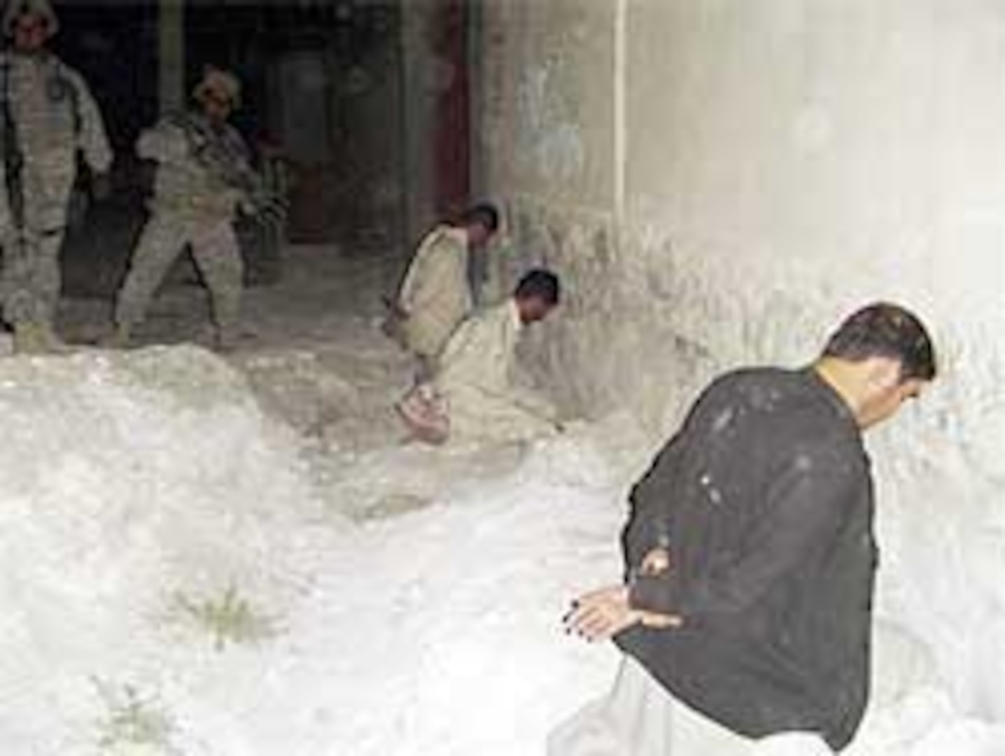 Camp Phoenix Security Forces (SECFOR) raided a nearby compound capturing 18 men suspected of pilfering U.S. connexes in route to Camp Phoenix. Soldiers from A Company, 1-186 Infantry Battalion, 41st BCT hold suspected thieves for questioning.