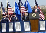 On behalf of all American citizens President George W. Bush accepts the Air Force Memorial during a dedication ceremony at its Arlington, Va. location overlooking the Pentagon on Saturday, Oct. 14, 2006. Looking on are, from left: Chief Master Sgt. of the Air Force Rodney J. McKinley, Air Force Chief of Staff Gen. T. Michael Moseley and Secretary of the Air Force Michael W. Wynne. Designed by the late James Ingo Freed the memorial with its three soaring spires inspired by the U.S. Air Force Thunderbirds bomb burst manuever, pays tribute to and honors the patriotic men and women of the U.S. Air Force and its predeccessor organizations. An open house will run near the Pentagon in conjunction with the dedication ceremony which will feature performances by the U.S. Air Force Band, the U.S. Air Force Honor Guard drill team, and will culminate with a concert featuring country music performer LeeAnn Womack. (U.S. Air Force photo/)