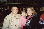 Terry Dean with his wife Alissa, and daughter Gracie, celebrate the unit's February 2005 return from Iraq.