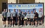 Soldiers from the 36th Combat Aviation Brigade take a photo near the U.S. Embassy in Baghdad, Iraq, before running the 2006 Veterans Day International Zone Marathon Nov. 11.