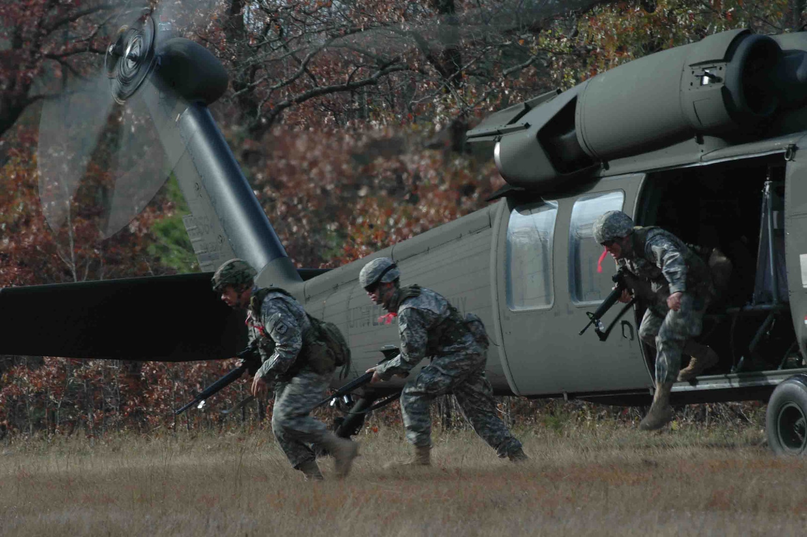 Arkansas' 77th Aviation Brigade provided the aviation assets to kick off the Combined Arms Team match during the 2006 Winston P. Wilson marksmanship competition. Competing teams were given patrol orders and navigated to the designated pickup zone. Upon dismounted the helicopter, the competitors had to make their way through several obstacles before ever engaging targets on the range, testing their Marksmanship and physical skills under simulated combat conditions. (Photo by ) 