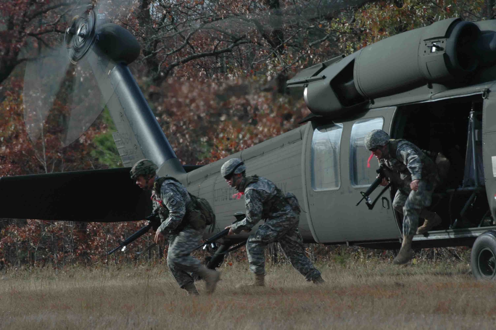 Arkansas' 77th Aviation Brigade provided the aviation assets to kick off the Combined Arms Team match during the 2006 Winston P. Wilson marksmanship competition. Competing teams were given patrol orders and navigated to the designated pickup zone. Upon dismounted the helicopter, the competitors had to make their way through several obstacles before ever engaging targets on the range, testing their Marksmanship and physical skills under simulated combat conditions. (Photo by ) 