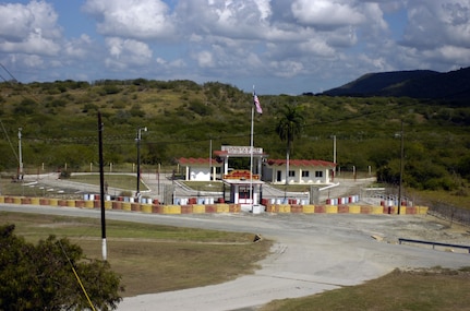 The Northeast Gate, seen here on Nov. 16, 2006, separates U.S. Naval Station Guantanamo Bay from the rest of Cuba. Joint Task Force-Guantanamo conducts the safe care and custody of enemy combatants detained in the Global War on Terrorism. About 13 percent of the task force is comprised of National Guard members.