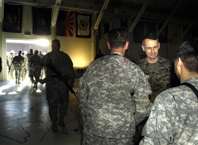 Marine Gen. Peter Pace, chairman of the Joint Chiefs of Staff, talks with soldiers after a town hall meeting at Camp Bondsteel, Kosovo, Nov. 14. Pace addressed questions from the soldiers that ranged from the recent elections to the future uses of Guard and Reserve forces.