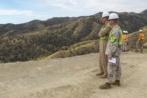 Col. Christopher C. Seymour, Marine Aircraft Group 26 commanding officer, and Lt. Col. Patrick R. Hittle, Marine Wing Support Squadron 272 commanding officer, Marine Corps Air Station New River, N.C., visit their Marines who are building and improving border roads in support of U.S. Customs and Border Protection in Southern Arizona, Mar. 19.

