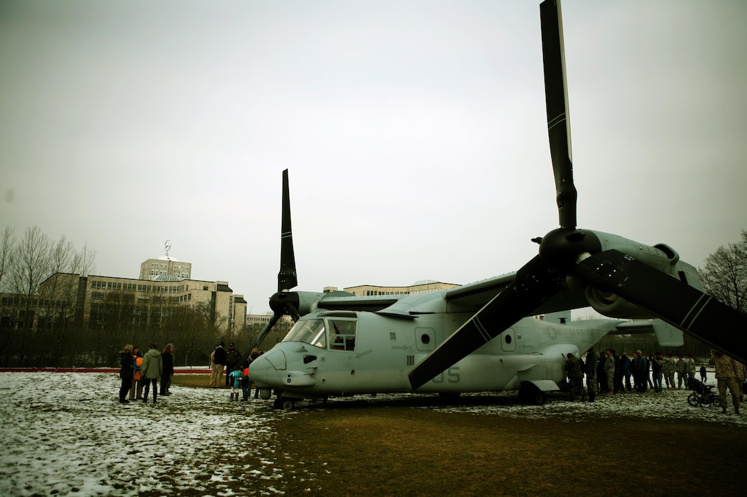 Members of the U.S. Army Garrison Stuttgart, Germany, community get a close look at an MV-22B Osprey from Marine Tiltrotor Squadron 266 (Reinforced), 26th Marine Expeditionary Unit, II Marine Expeditionary Force, Camp Lejeune, N.C., while it is staged on Kelley Field for a capabilities demonstration at Kelly Barracks, March. 28. U.S. Marine Corps Forces Europe, U.S. Marine Corps Forces Africa, in coordination with U.S. European Command, U.S. Africa Command, the community of U.S. Army Garrison Stuttgart, Germany, received  “hands-on” experience with the MV-22B Osprey during a capabilities exercise on Patch Barracks, Kelly Barracks, and Stuttgart Army Airfield, that helped to familiarize the combatant commands with the possibilities and new abilities the aircraft could provide throughout their respective area of reach. The three MV-22 Osprey crews flew 1400 nautical miles from the Atlantic Ocean, without having to land to refuel, before arriving two days earlier. The MV-22 Osprey possess twice the speed, can fly twice as high, carry three times the payload, and travels five times the distance of other legacy, medium-lift helicopters. 
