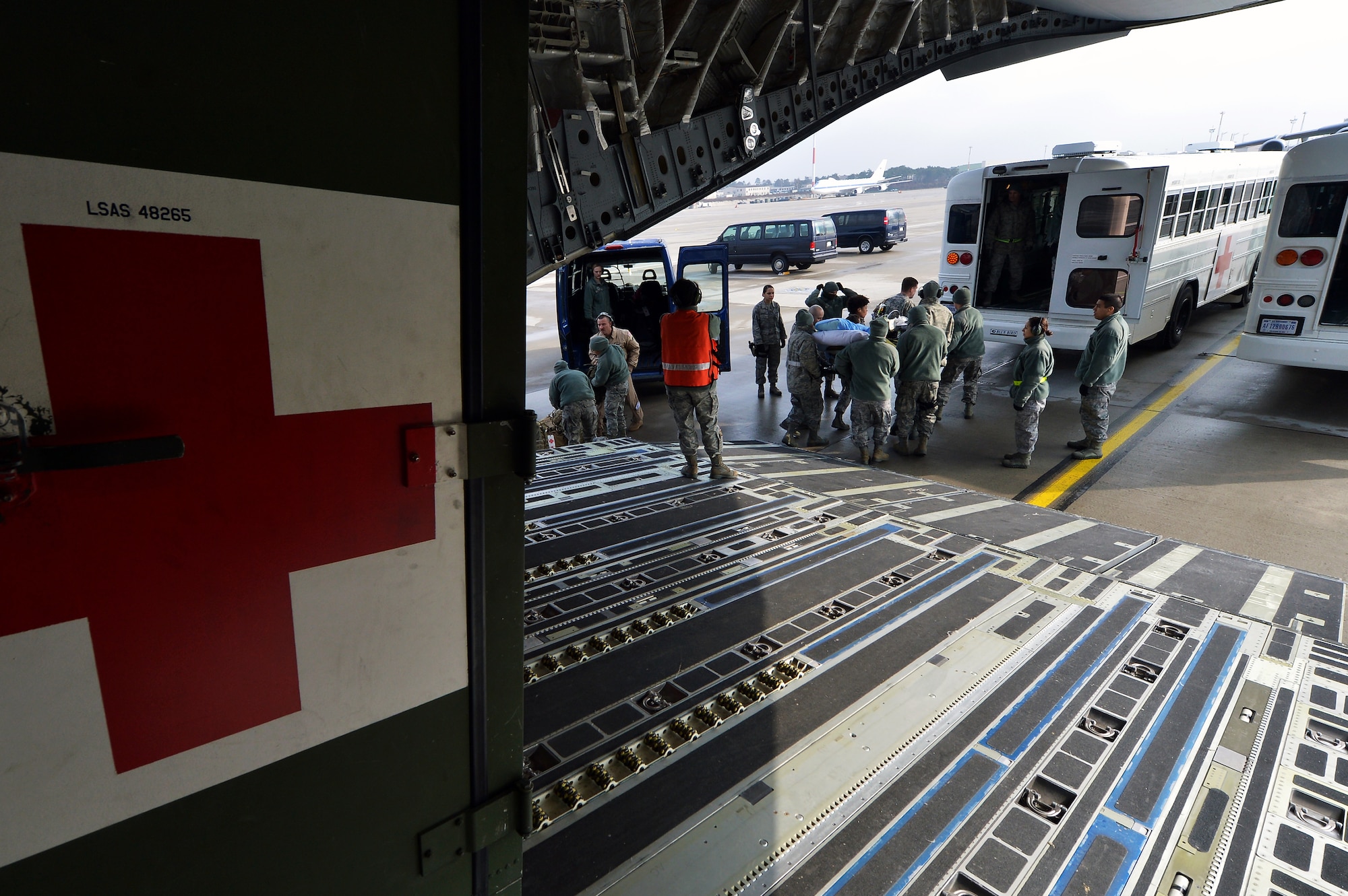 Members of the 455th Expeditionary Aeromedical Evacuation Squadron and the Contingency Aeromedical Staging Facility at Ramstein Air Base assist patients on a bus bound for Landstuhl Regional Medical Center, Germany, March 22, 2013.  LRMC provides state of the art care, using sophisticated invasive/non-invasive medical equipment and is the only tertiary intensive care unit within the European theatre.  (U.S. Air Force photo/Senior Airman Chris Willis)