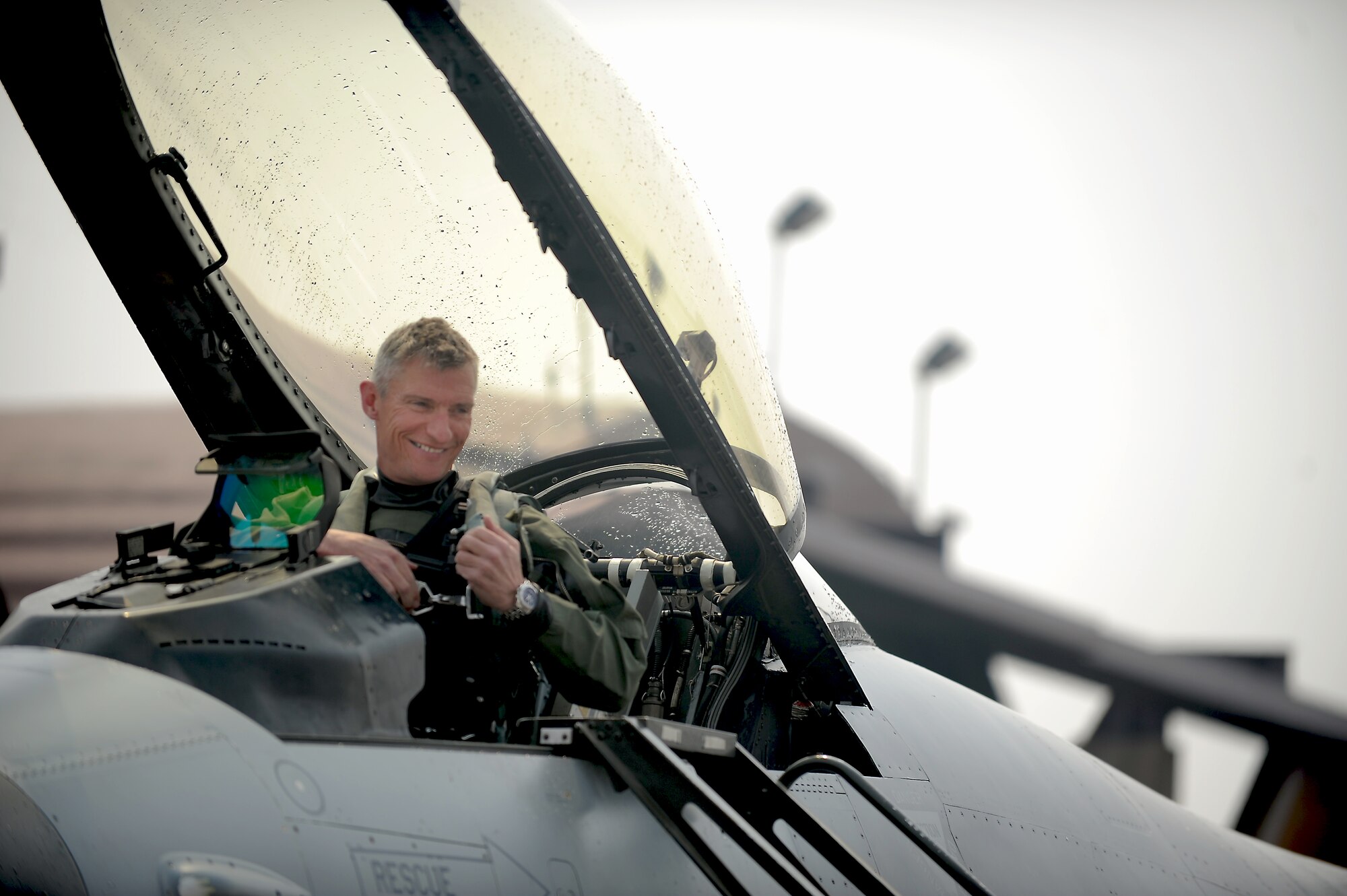 Col. Patrick McKenzie, 51st Fighter Wing commander, prepares to exit his F-16 Fighting Falcon after reaching 3,000 flying hours at Osan Air Base, Republic of Korea, March 28, 2013. Only a little more than 200 F-16 pilots worldwide are documented as sharing this 3,000-hour achievement. (U.S. Air Force photo/Staff Sgt. Sara Csurilla) 