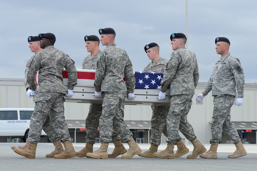 A U.S. Army carry team transfers the remains of Sgt. Michael C. Cable of Philpot, Ky., during a dignified transfer March 28, 2013, at Dover Air Force Base, Del. Cable was assigned to Headquarters and Headquarters Company, 1st Battalion, 327th Infantry, 1st Brigade Combat Team, 101st Airborne Division, Ft. Campbell, Ky. (U.S. Air Force photo/Greg L. Davis)