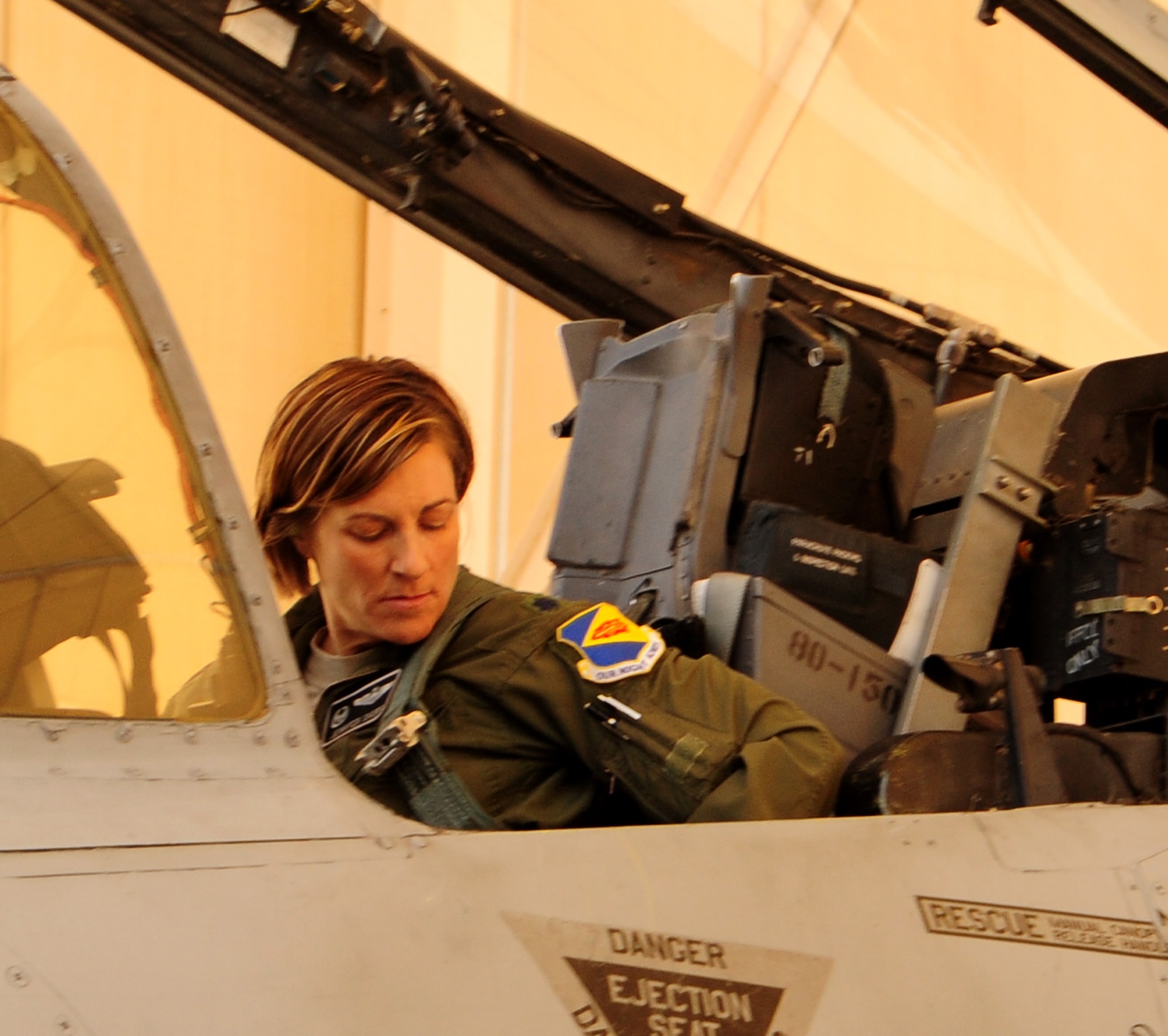 U.S. Air Force Lt. Co.l Jennifer Short, 358th Fighter Squadron commander, prepares for a training flight on an A-10 Thunderbolt II at Davis-Monthan Air Force Base, Ariz., March 27, 2013. Lt. Col Short is preparing for a training flight as an instructor pilot. (U.S. Air Force photo by Senior Airman Camilla Griffin/Released)