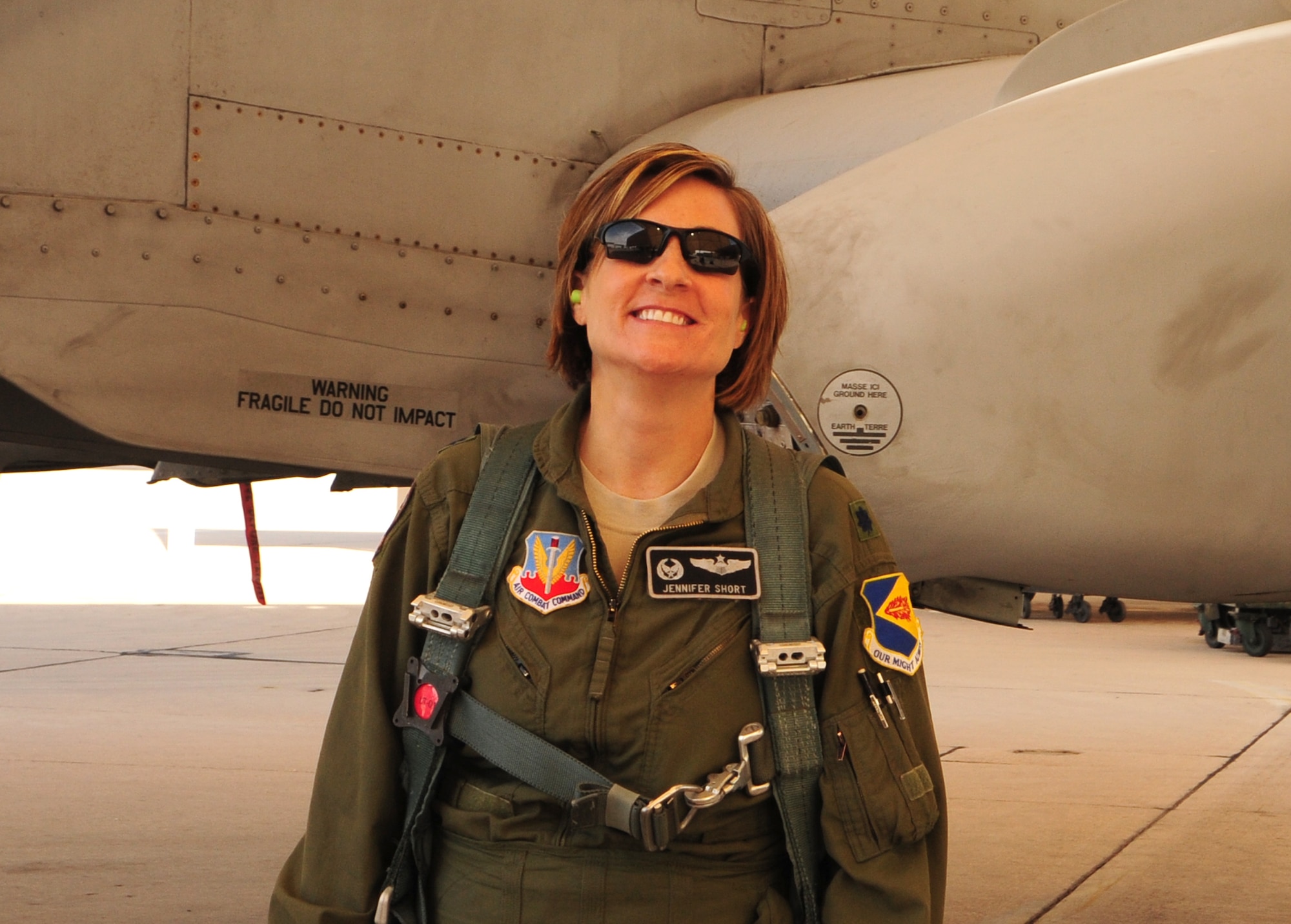 U.S. Air Force Lt. Co.l Jennifer Short, 358th Fighter Squadron commander, prepares for a flight on an A-10 Thunderbolt II at Davis-Monthan Air Force Base, Ariz., March 27, 2013. Lt. Col Short is preparing for a training flight as an instructor pilot. (U.S. Air Force photo by Senior Airman Camilla Griffin/Released)