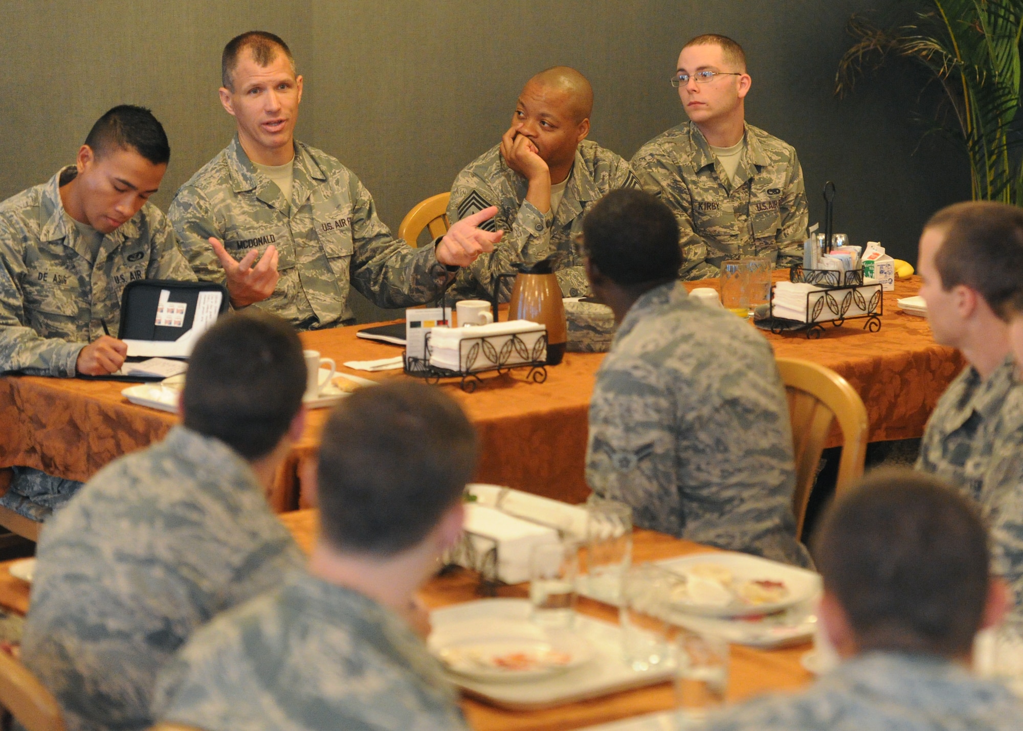 Chief Master Sgt. Steve McDonald, Pacific Air Forces command chief, joined by Command Chief Master Sgt. Leslie Bramlett, 15th Wing command chief, addresses 15th Wing Airmen at the Hale Aina dining facility at Joint Base Pearl Harbor-Hickam, Hawaii, March 26, 2013. While at the breakfast McDonald addressed recent concerns regarding sequestration and its effects on enlisted personnel. (U.S. Air Force photo/Tech. Sgt. Jerome S. Tayborn)