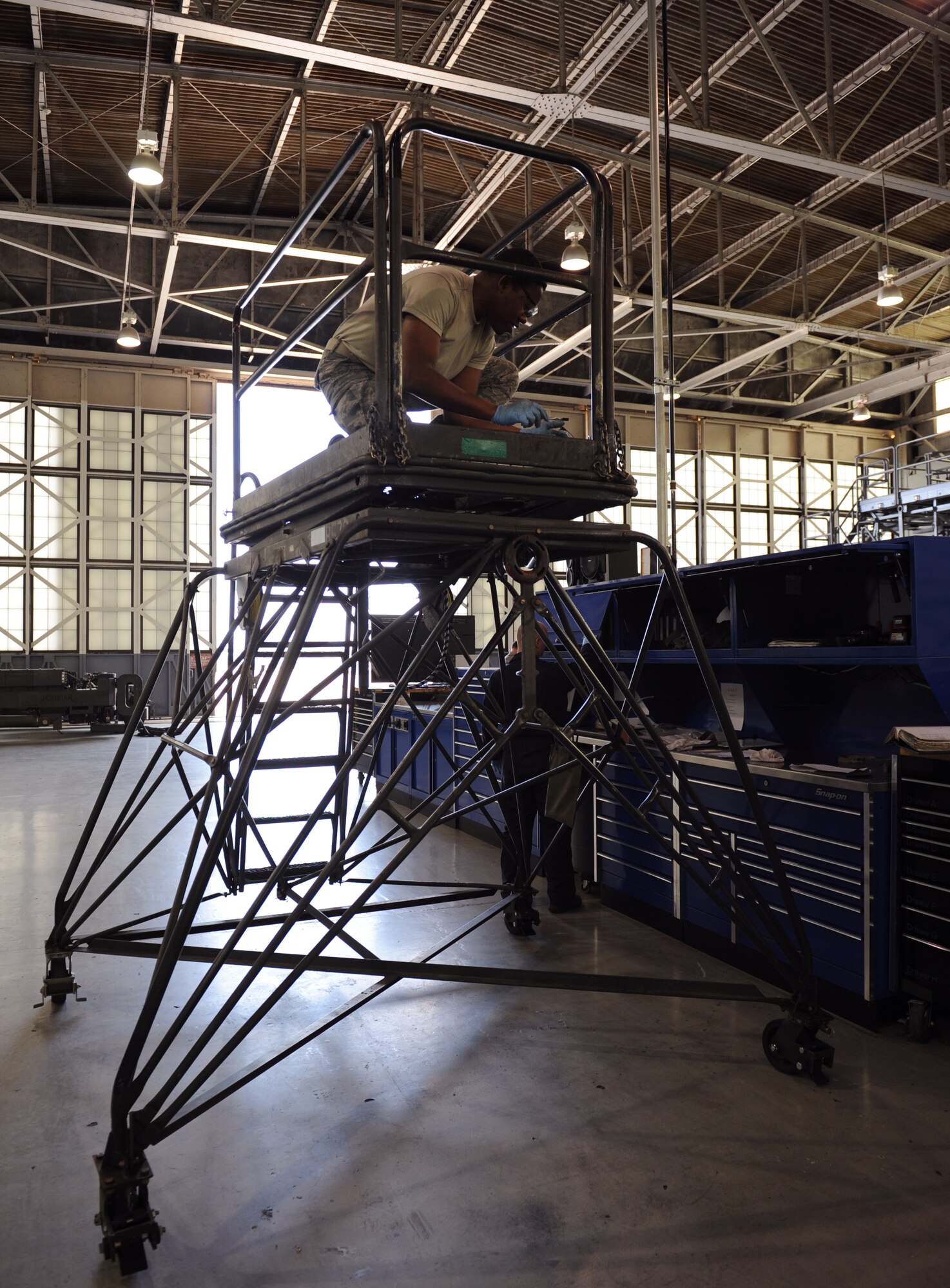 Airman 1st Class Antonio Simon, 2nd Maintenance Squadron Aerospace Ground Equipment flight, lubricates a piece of metal on Barksdale Air Force Base, La., March 28. In order to prevent friction, lubrication oil is placed on all moving parts. (U.S. Air Force photo/Airman 1st Class Benjamin Gonsier)