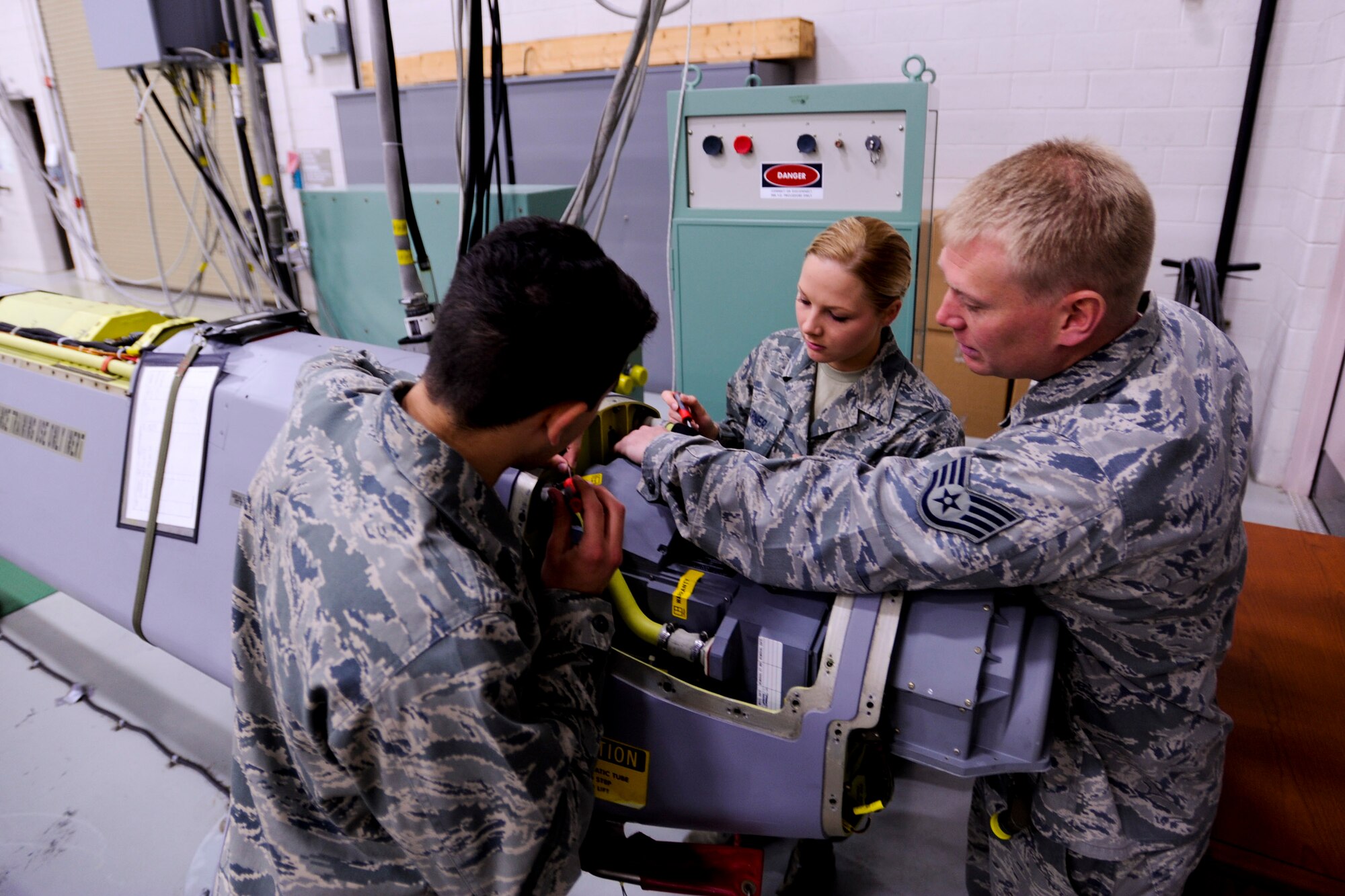 VANDENBERG AIR FORCE BASE, Calif. – Staff Sgt. Douglas Hull, a 532nd Training Squadron air launch missile maintenance instructor, demonstrates how to work on an Air Launched Cruise Missiles to 532nd TRS students through a simulator here Wednesday, March 27, 2013. The squadron recently received four of the simulators from Tinker Air Force Base, Okla. to replace the old “worn-out” ones and provide a more realistic training environment.  (U.S. Air Force photo/Airman Yvonne Morales) 