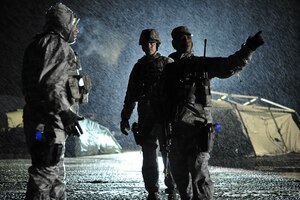 Security forces members assigned to the 621st Contingency Response Wing discuss the layout of camp defenses on the first night of Eagle Flag 13-2 March 18, 2013, at Joint Base McGuire-Dix-Lakehurst, N.J. Airmen from the CRW paired with Soldiers from the 690th Rapid Port Opening Element based at Joint Base Langley-Eustis, Va., and participated in a U.S. Transportation Command Joint Task Force Validation exercise. (U.S. Air Force photo/Tech. Sgt. Parker Gyokeres)
