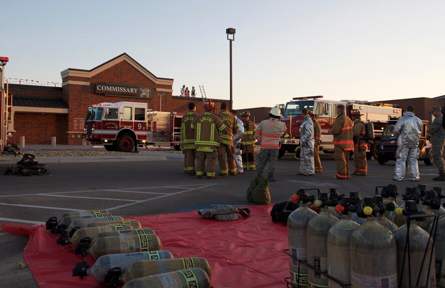 Dyess Air Force Base emergency responders and Abilene Fire Department respond to a fire at the base commissary, March 25, 2013, at Dyess Air Force Base, Texas. The fire was reported at approximately 5:30 p.m. and was extinguished by 6:30 p.m. About 30 Dyess firefighters and eight Abilene firefighters responded to the scene. The cause of the fire is still under investigation. The commissary will reopen for business March 28 at 10 a.m. with limited access to some aisles.  (U.S. Air Force photo by Staff Sgt. Richard P. Ebensberger/Released)