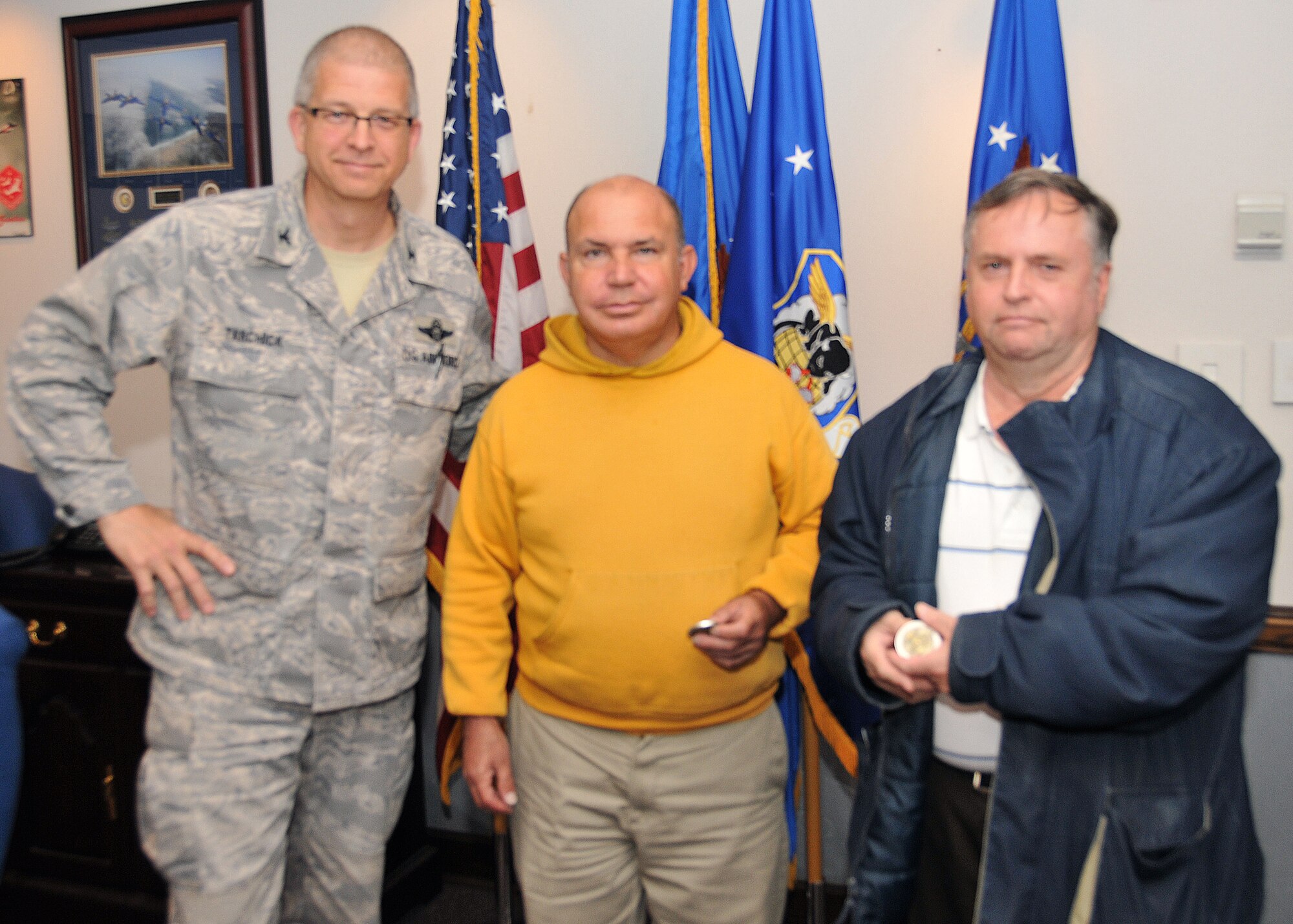 David Felix and Ernest “Getting-it-done” Frame were honored by Tarchick with the “Lunch Pail” Award, given to personnel who may not receive a lot of recognition because they primarily operate behind the scenes. Felix and Frame each received a 94th AW commander’s coin for their dedicated service March 28 at a wing staff meeting held in the 94th AW headquarters building. (U.S. Air Force photo/Senior Airman Elizabeth Van Patten)