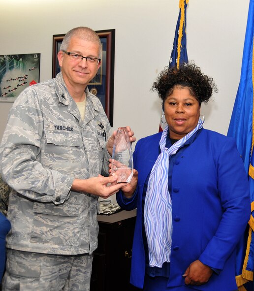 Bobbie Mitchell, 94th Communications Squadron administrative assistant, was honored as the 2012 Information Dominance Air Force Outstanding Civilian Technician. Mitchell also received a 94th AW commander’s coin for herdedicated service March 28 at a wing staff meeting held in the 94th AW headquarters building. (U.S. Air Force photo/Senior Airman Elizabeth Van Patten)