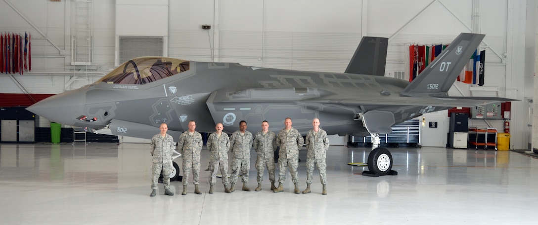 From left, 914th Logistics Readiness Squadron members Senior Master Sgt. Doni Henry, Tech. Sgt. Joseph Foucha, Tech. Sgt. Mark Loughrey, Tech. Sgt. Jerry Evans, Staff Sgt. Lyle Szpakowski, Tech. Sgt. Ronald Smith, and Staff Sgt. Jason Borghi pose in front of an F-35 Lightning II at Nellis Air Force Base, Nev. March 14-21, 2013.  These Airmen from the Niagara Falls Air Reserve Station, N.Y. completed more than a week of extensive training in their respective AFSCs.  (U.S. Air Force courtesy photo)
