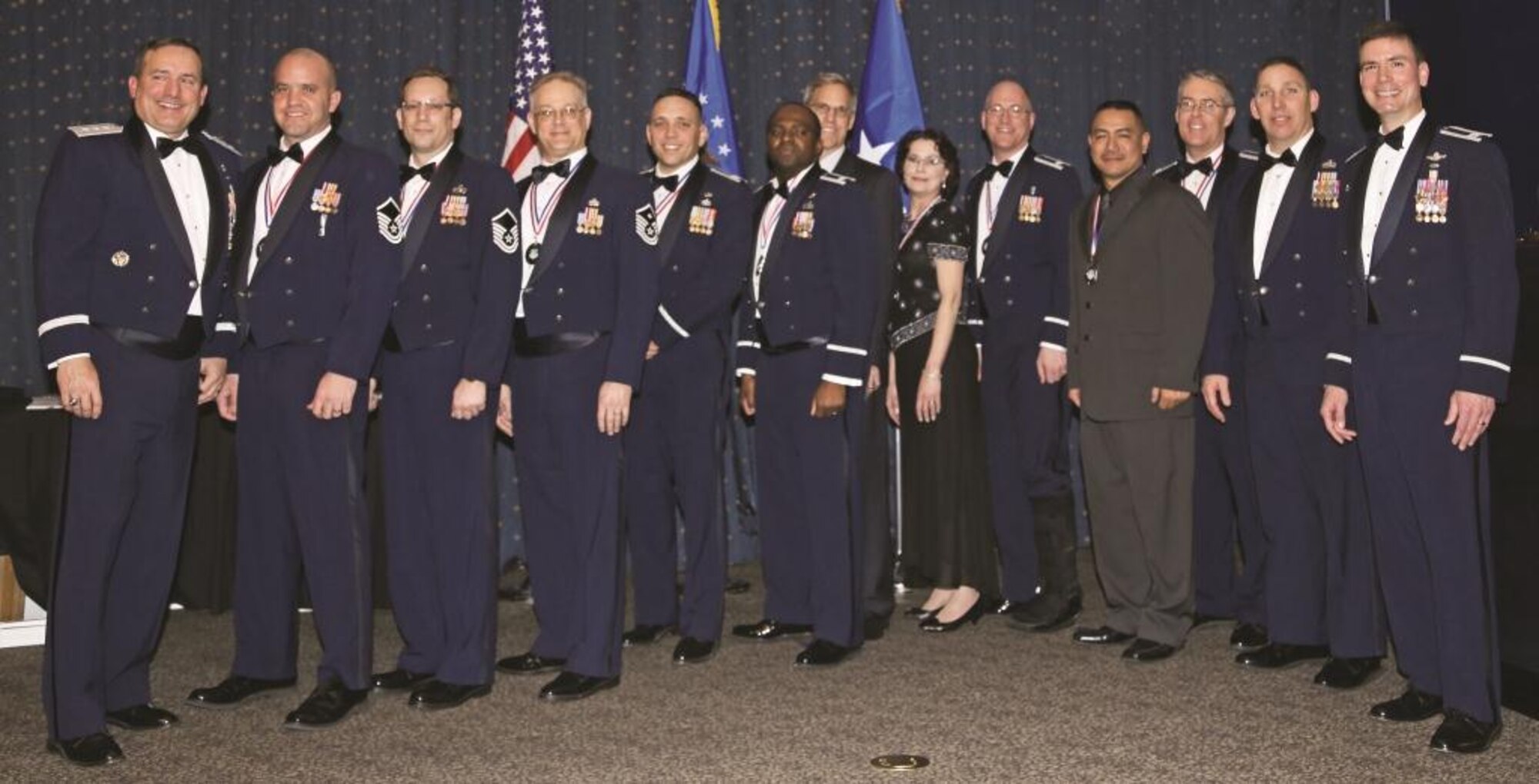 The Air Force Inspection Agency recognized outstanding team members Feb. 28 during the agency’s 2012 annual awards ceremony. From left to right: Lt. Gen. Stephen Mueller, the Air Force Inspector General; Master Sgt. James Spino, Commander’s Leadership Award; Master Sgt. Tim Pesavento, Enlisted Inspector of the Year; David Wheelock Jr., Civilian of the Year, Category I; Capt. Jesse Goens, Company Grade Officer of the Year; Lt. Col. Se’kou  Billings, Field Grade Officer of the Year; Robert Pyeatt, Civilian Inspector of the Year; Valerie Lindsey, Civilian of the Year, Category IV; Lt. Col. Kevin McCal, Officer Inspector of the Year; Tracy Leon-Guerrero, Civilian of the Year, Category II; Lt. Col. Aaron Bass, Innovator of the Year; Chief Master Sgt. David McBride, AFIA Enlisted Manager; and Col. Paul Tibbets IV, AFIA commander. Recipients not pictured are Tech. Sgt. Robyn Werner, Noncommissioned Officer of the Year; Senior Master Sgt. Franklin Chism, Senior Noncommissioned Officer of the Year; and Barbara Johnston, Civilian of the Year, Category III.

